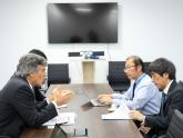Cima with the Deputy Minister of International Affairs of Japan's Ministry of Economy, Trade, and Industry, Matsuo Takehik