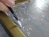 Aplicación de estuco en pintura de caballete